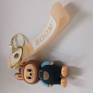 Brown and Blue Character Keychain with Cream Strap